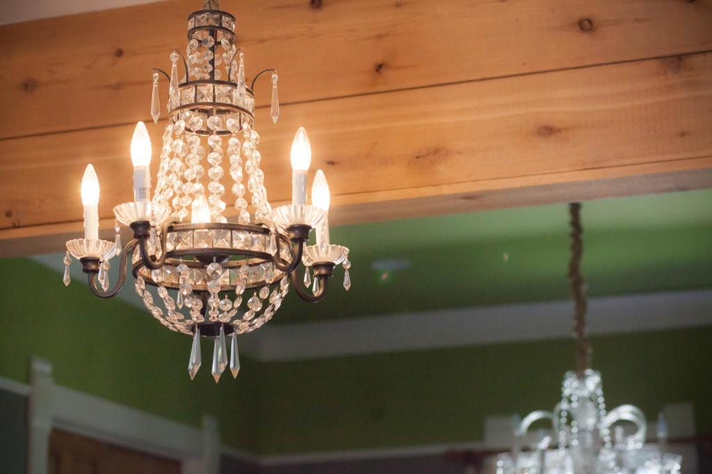 a chandelier hanging from a wooden ceiling at Nestle Inn in Indianapolis