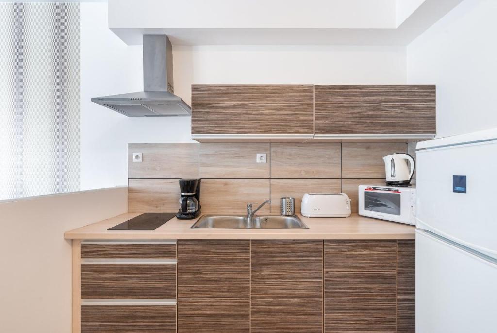 Kuchyň nebo kuchyňský kout v ubytování Corvin Residence Apartments