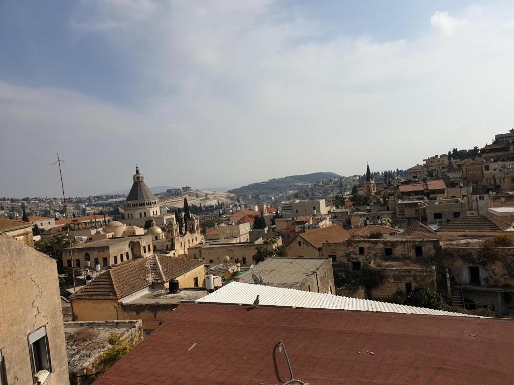 a view of a city with buildings and roofs at Apartment of Aamer(old city) in Nazareth