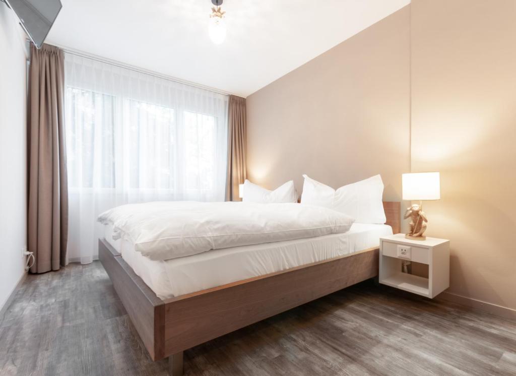 Postel nebo postele na pokoji v ubytování Hotel Birsighof Basel City Center