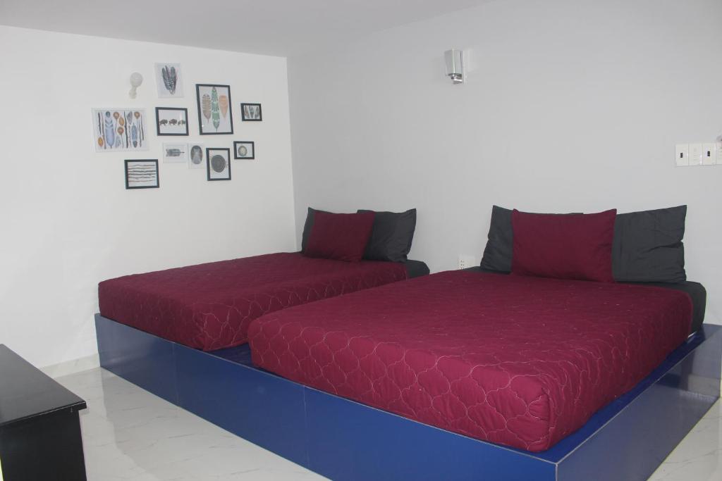 Postel nebo postele na pokoji v ubytování Phuc Hau Hotel