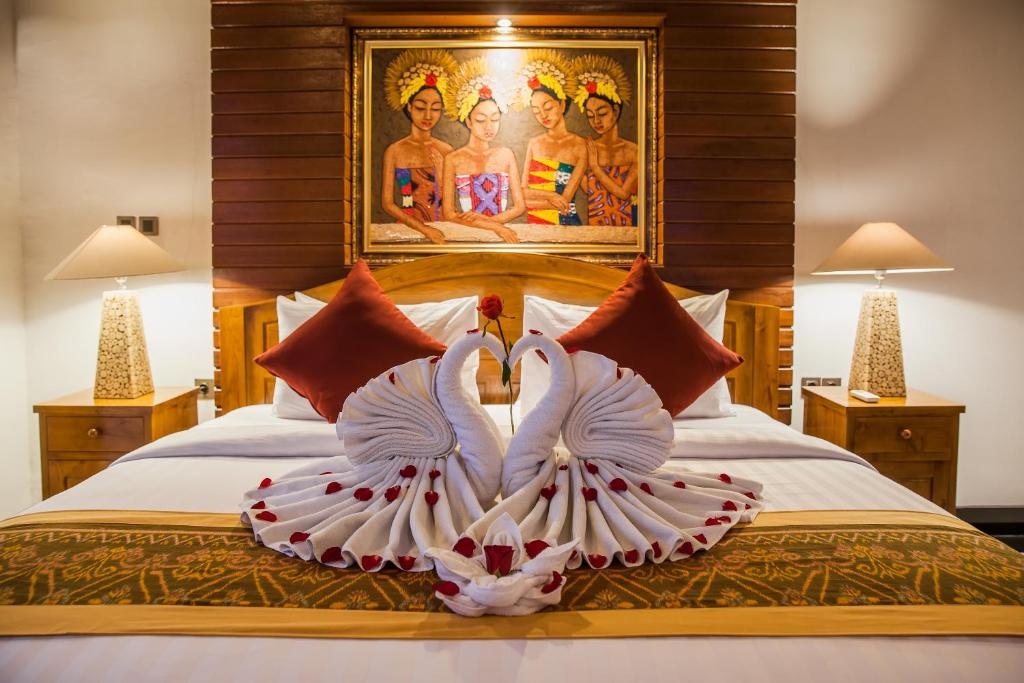 Ένα ή περισσότερα κρεβάτια σε δωμάτιο στο Uma Galih Ubud Villa