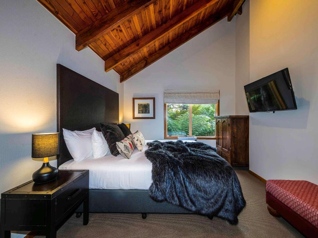 Postel nebo postele na pokoji v ubytování Grand Mercure Puka Park Resort