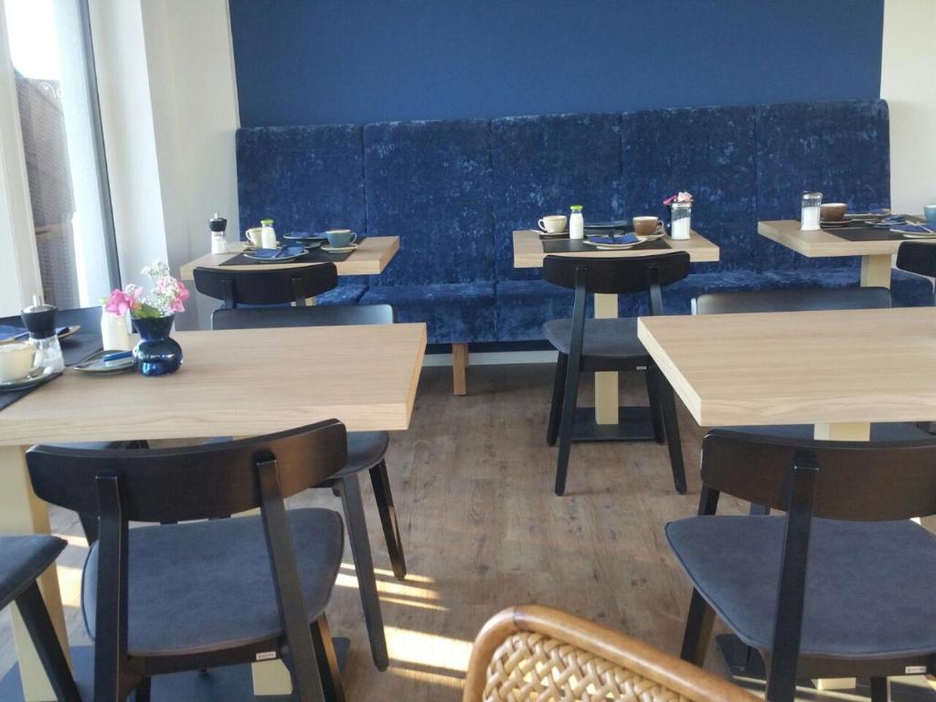 Restaurace v ubytování Haus Achtern Diek in erster Reihe am Meer