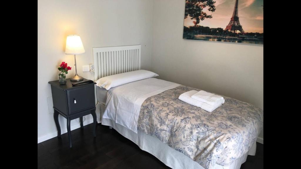 Posteľ alebo postele v izbe v ubytovaní Kentia Rooms