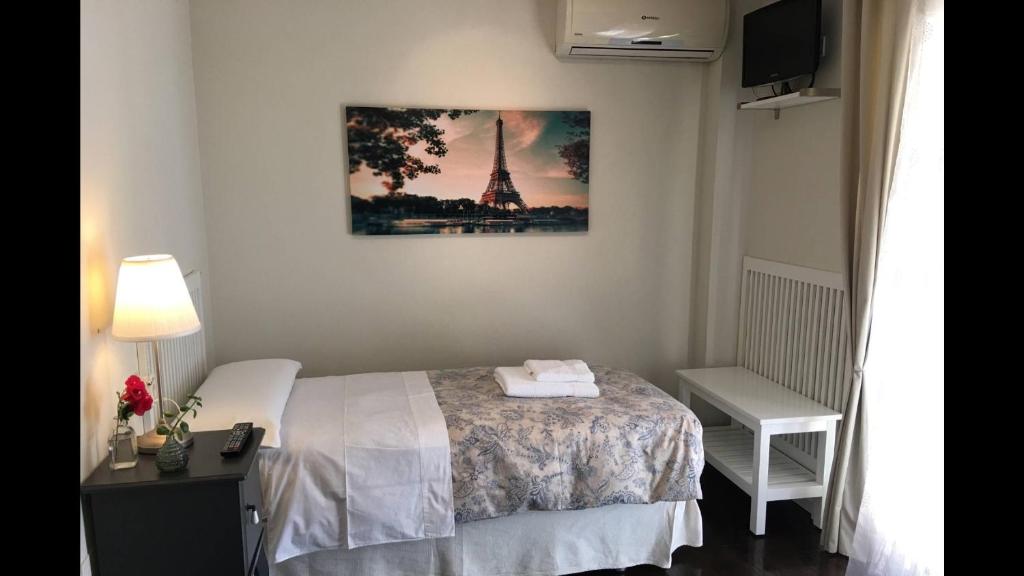 Posteľ alebo postele v izbe v ubytovaní Kentia Rooms