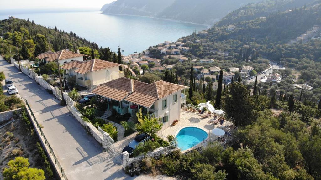 an aerial view of a house with a swimming pool at Deep Blue in Agios Nikitas
