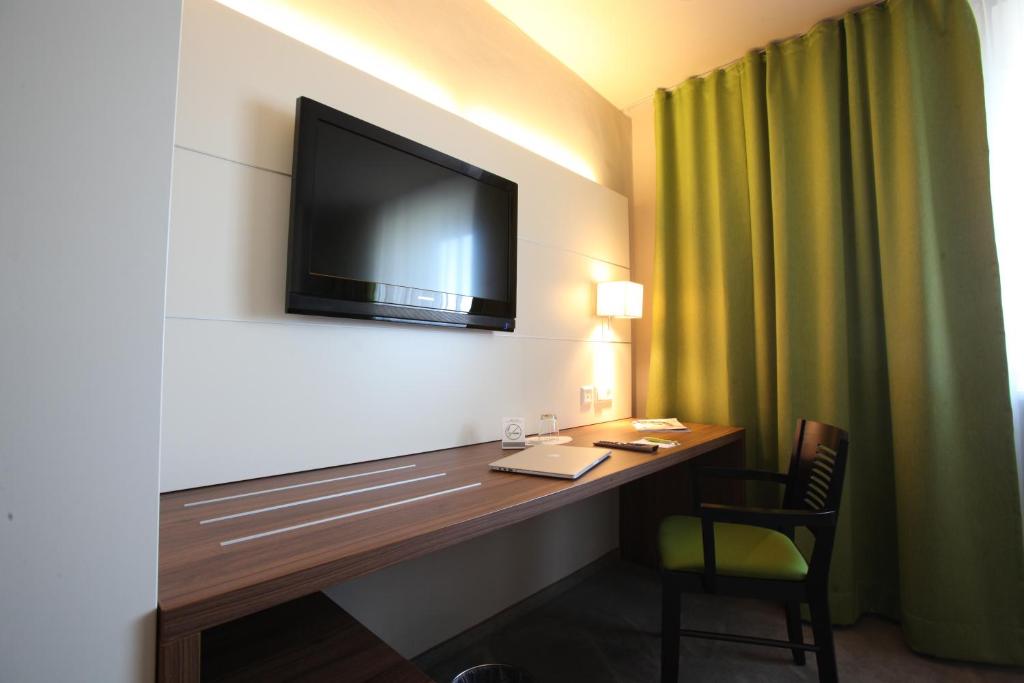 TV a/nebo společenská místnost v ubytování Hotel Kunstmühle