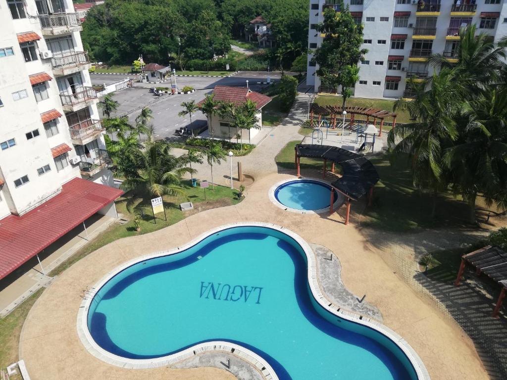 an overhead view of a swimming pool at a resort at PD Homestay Laguna / Ocean Apartment in Port Dickson