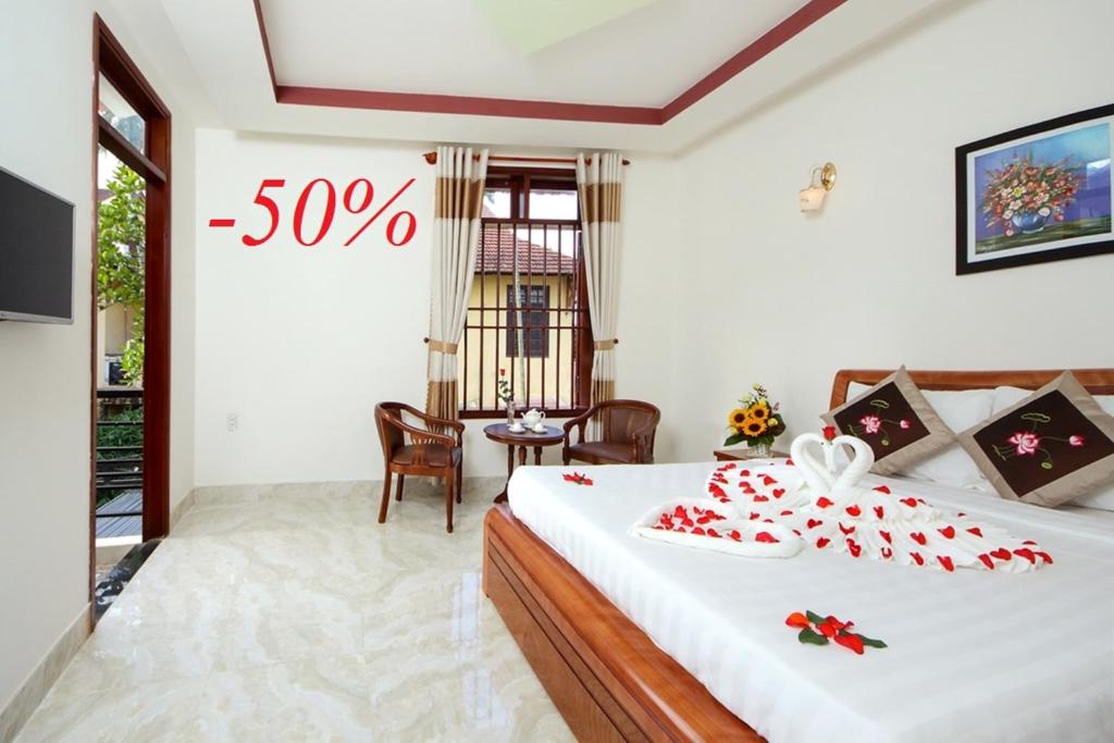 Postel nebo postele na pokoji v ubytování Hoi An Dat Cam Homestay