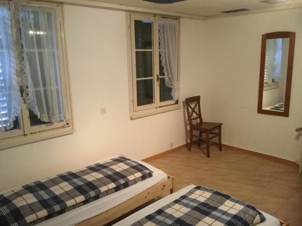 Postel nebo postele na pokoji v ubytování Tell Apartments Stans