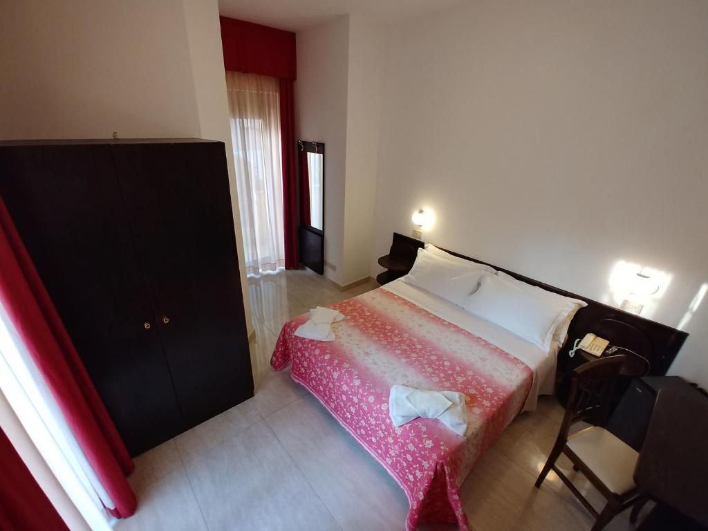 Postel nebo postele na pokoji v ubytování Hotel Memory