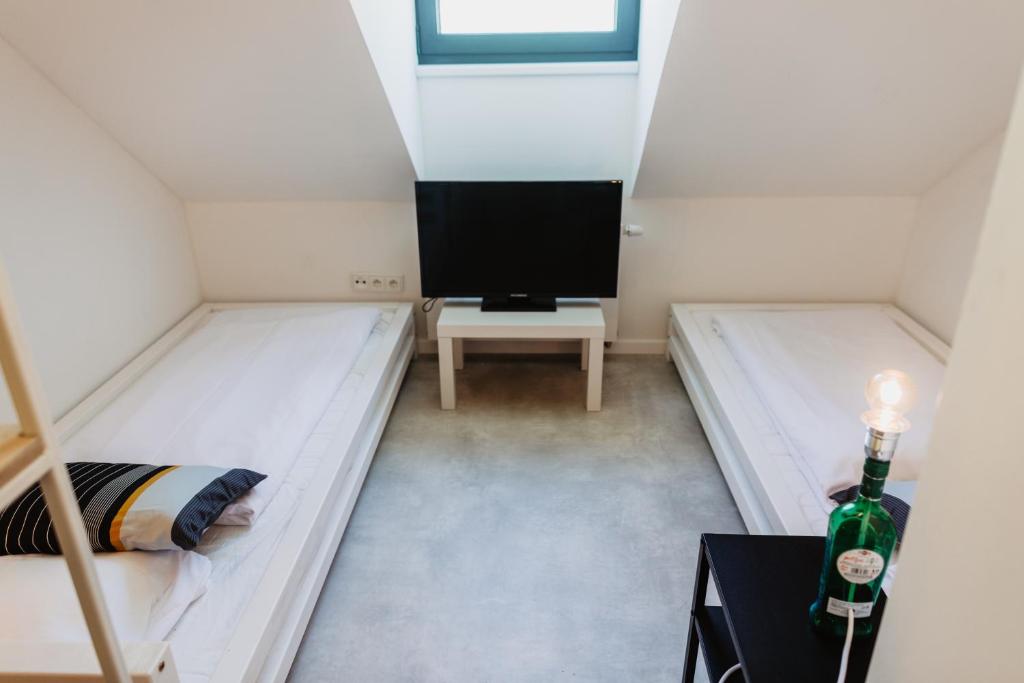 A bed or beds in a room at Street Food Possonium Apartments