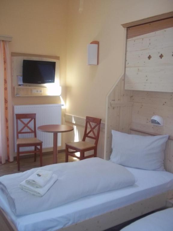 Postel nebo postele na pokoji v ubytování JUFA Hotel Gitschtal