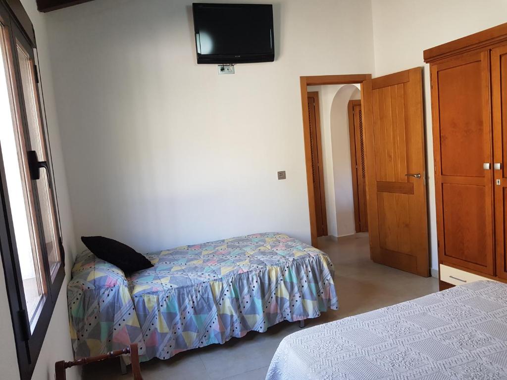 Postel nebo postele na pokoji v ubytování Casita la Herilla