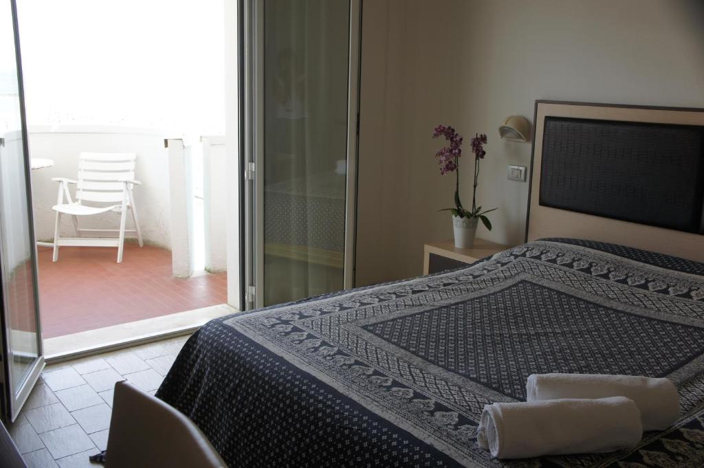 Postel nebo postele na pokoji v ubytování Hotel Marco
