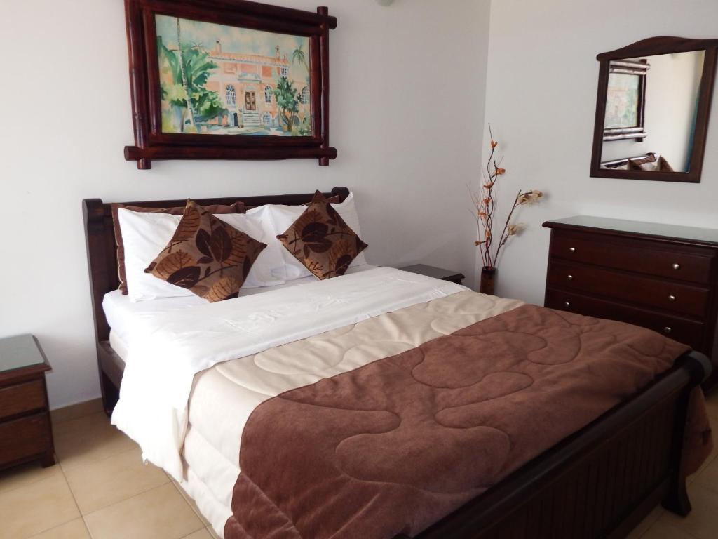 Postel nebo postele na pokoji v ubytování Hotel Campestre Villa Yudy