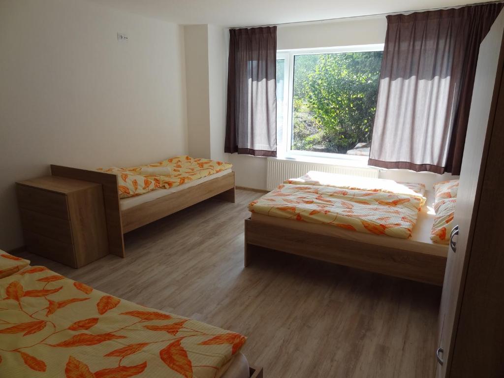 Postel nebo postele na pokoji v ubytování Vila Lom