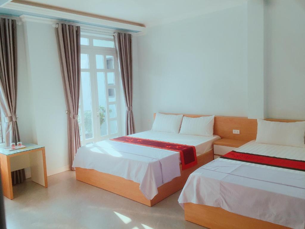 Postel nebo postele na pokoji v ubytování Cat Ba Central Homestay