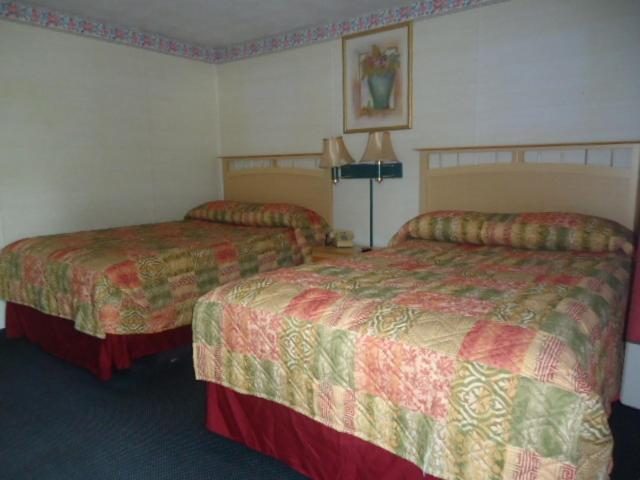 Postel nebo postele na pokoji v ubytování Relax Inn