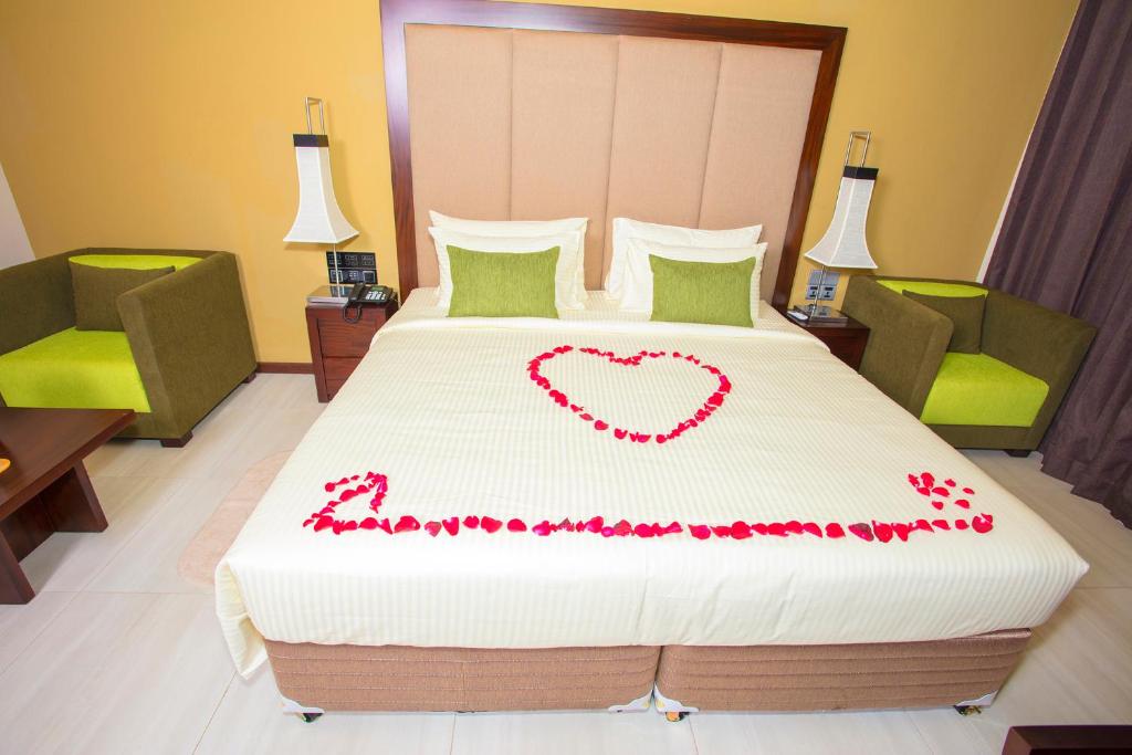 Postel nebo postele na pokoji v ubytování Amora Lagoon Hotel