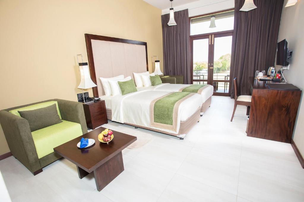 Postel nebo postele na pokoji v ubytování Amora Lagoon Hotel