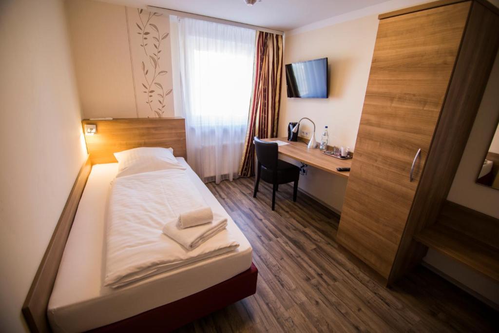 Postel nebo postele na pokoji v ubytování Hotel Heisede