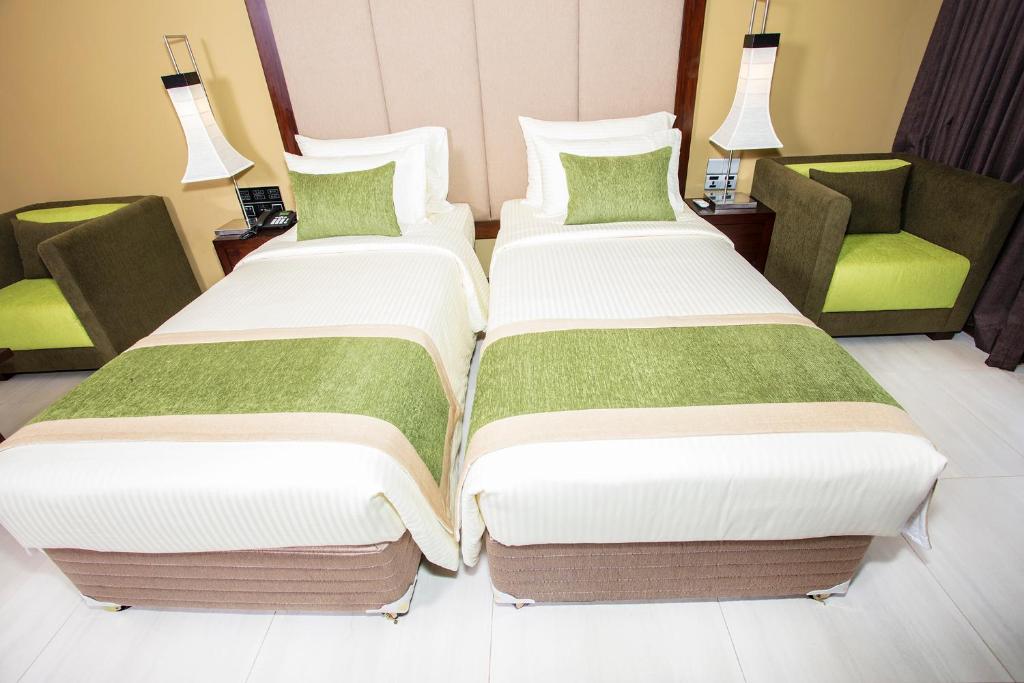 Postel nebo postele na pokoji v ubytování Amora Lagoon Hotel