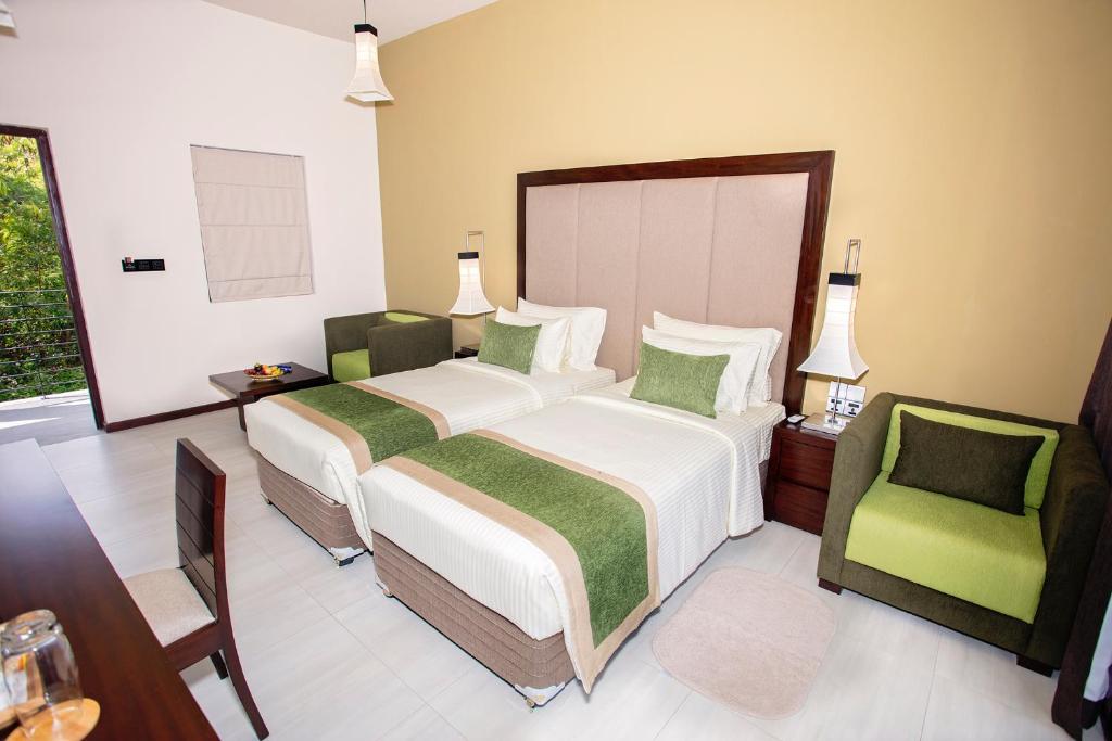 Postel nebo postele na pokoji v ubytování Amora Lagoon Hotel