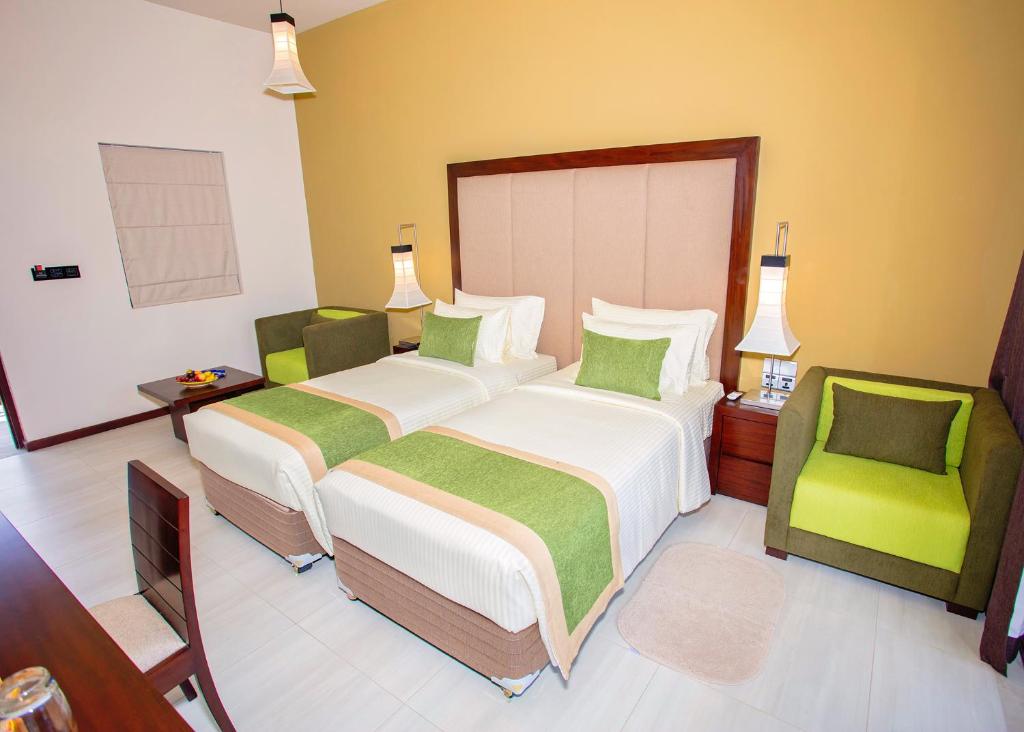 Postel nebo postele na pokoji v ubytování Amora Lagoon Hotel