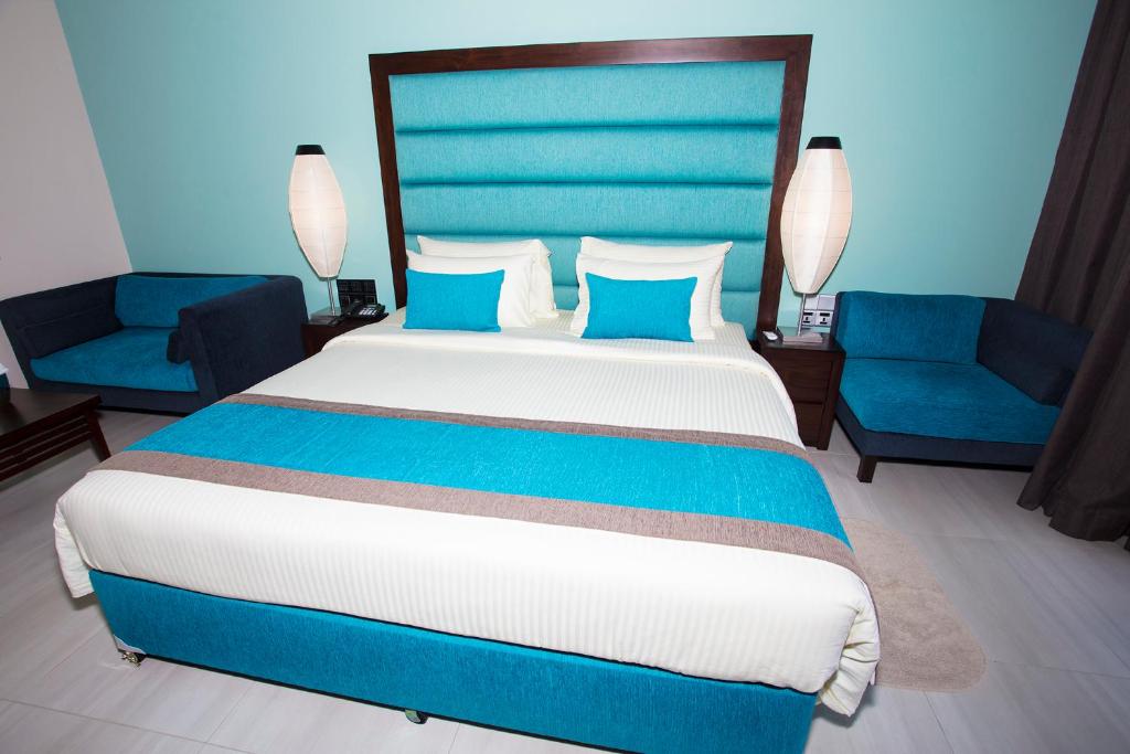 Postel nebo postele na pokoji v ubytování Amora Lagoon Hotel