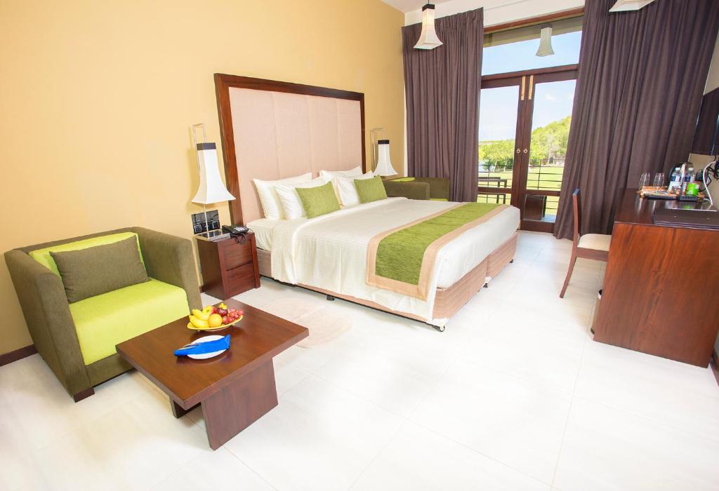 Postel nebo postele na pokoji v ubytování Amora Lagoon Hotel