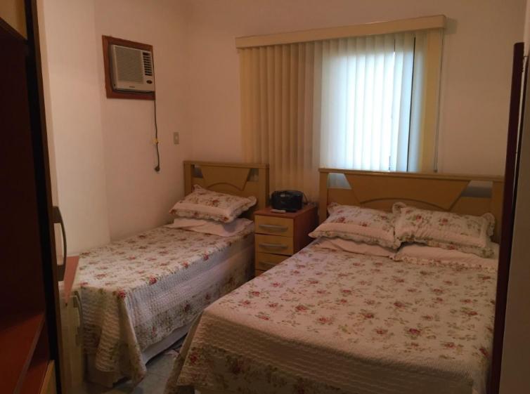 Кровать или кровати в номере Apartamento aconchegante proximo à praia