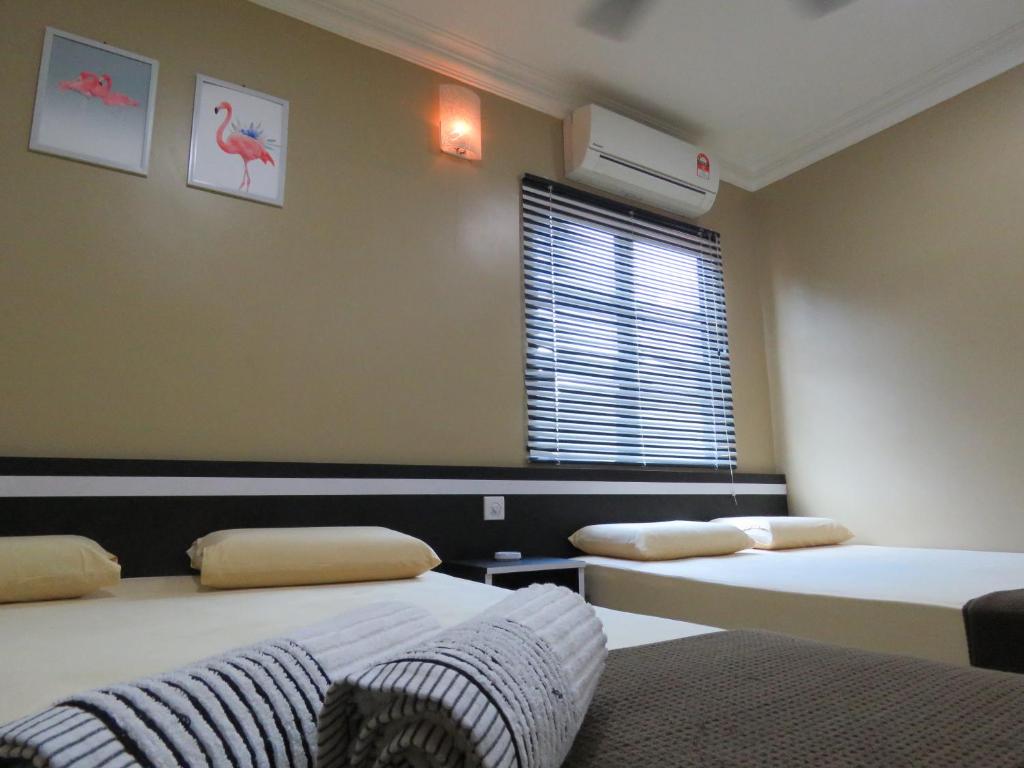 En eller flere senge i et værelse på Gm Motel