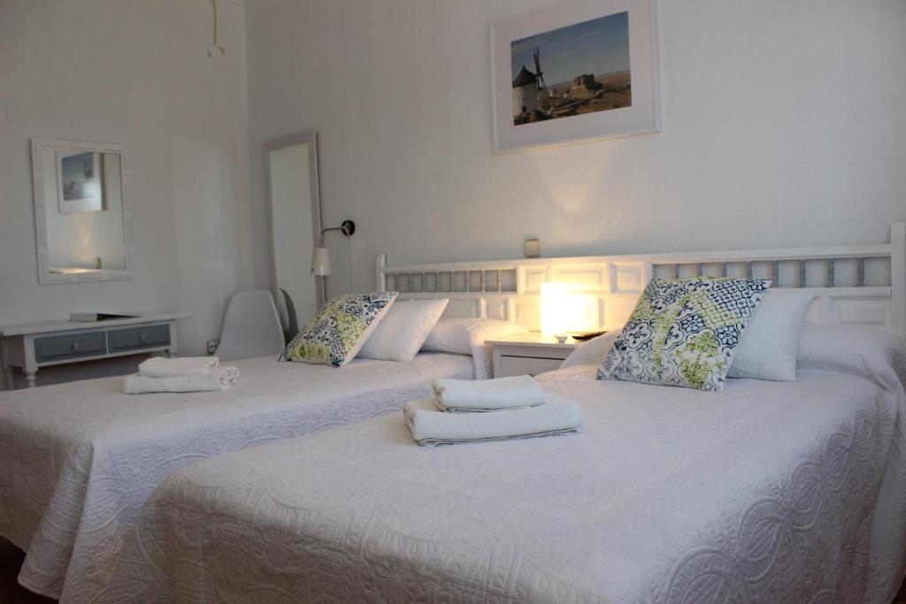 Postel nebo postele na pokoji v ubytování Hotel Consuegra
