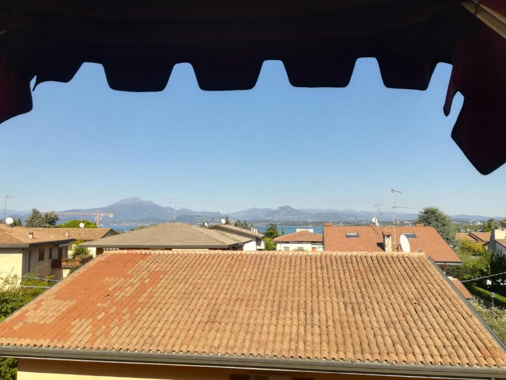 a view through a window of a roof at Hotel Primavera in Peschiera del Garda
