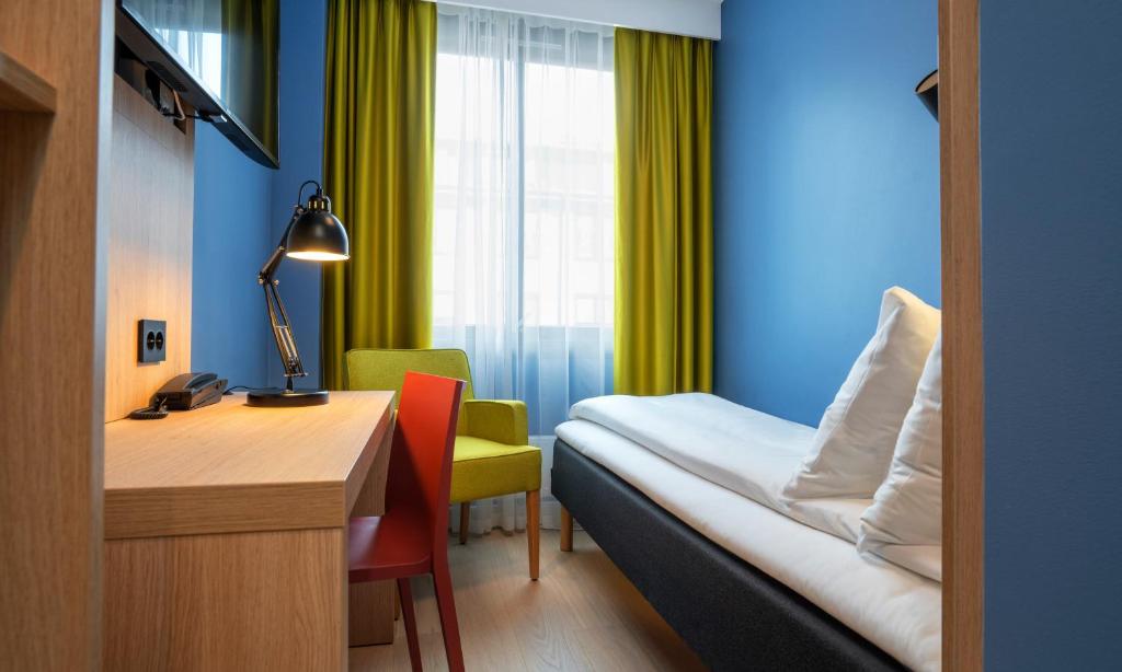 Postel nebo postele na pokoji v ubytování Thon Hotel Astoria