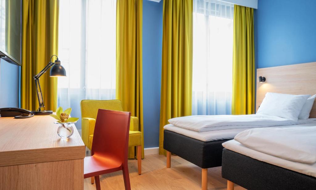 Postel nebo postele na pokoji v ubytování Thon Hotel Astoria