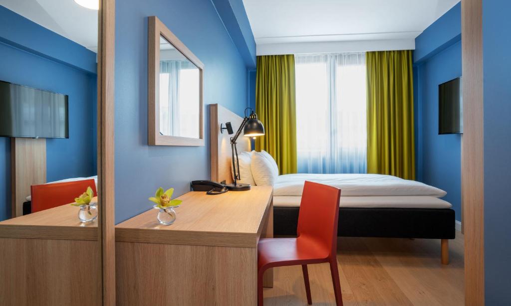 Postel nebo postele na pokoji v ubytování Thon Hotel Astoria