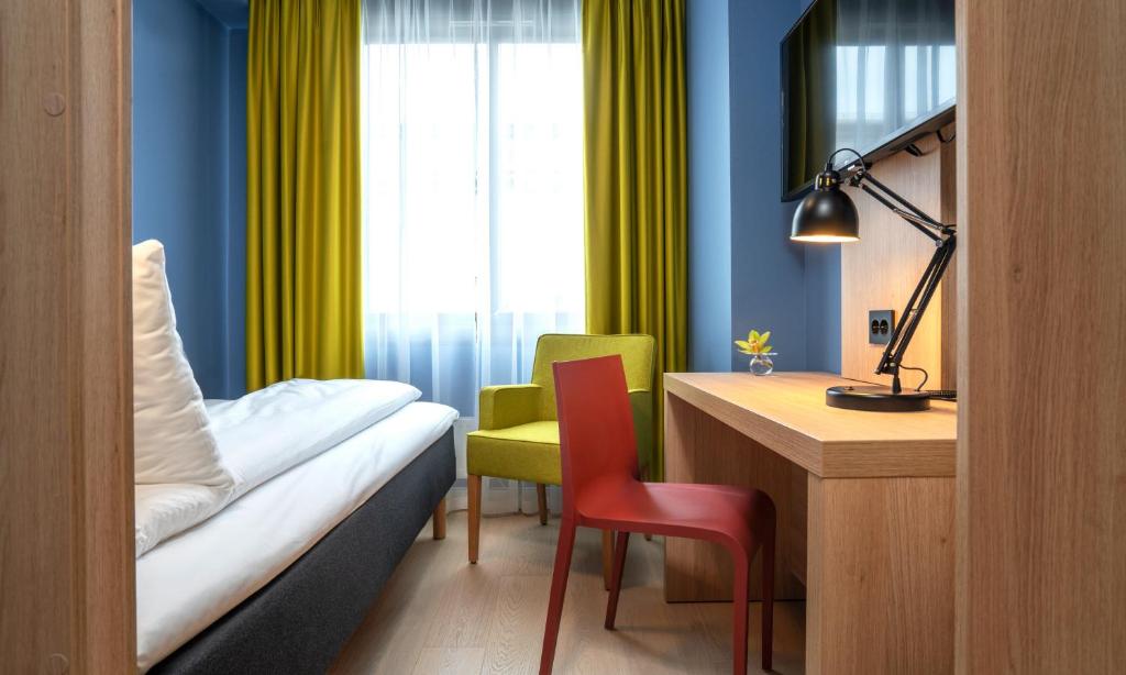 Postel nebo postele na pokoji v ubytování Thon Hotel Astoria