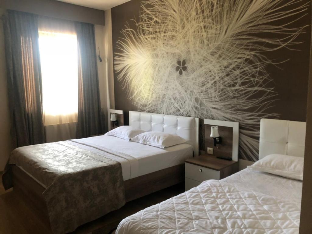 Postel nebo postele na pokoji v ubytování The K Tbilisi