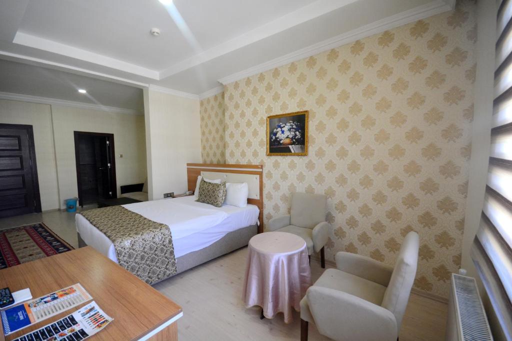 Katil atau katil-katil dalam bilik di Dimet Park Hotel