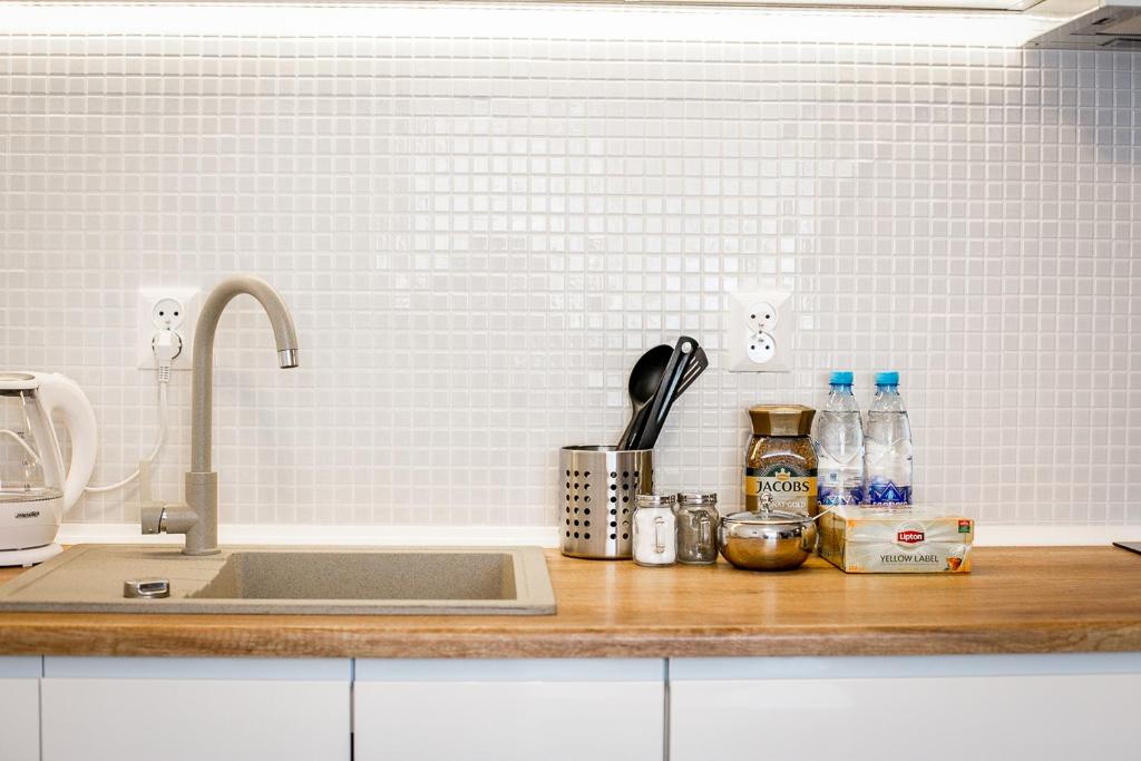 Kuchyňa alebo kuchynka v ubytovaní FUDA APARTAMENT DZIECI WRZESIŃSKICH 6/1/1