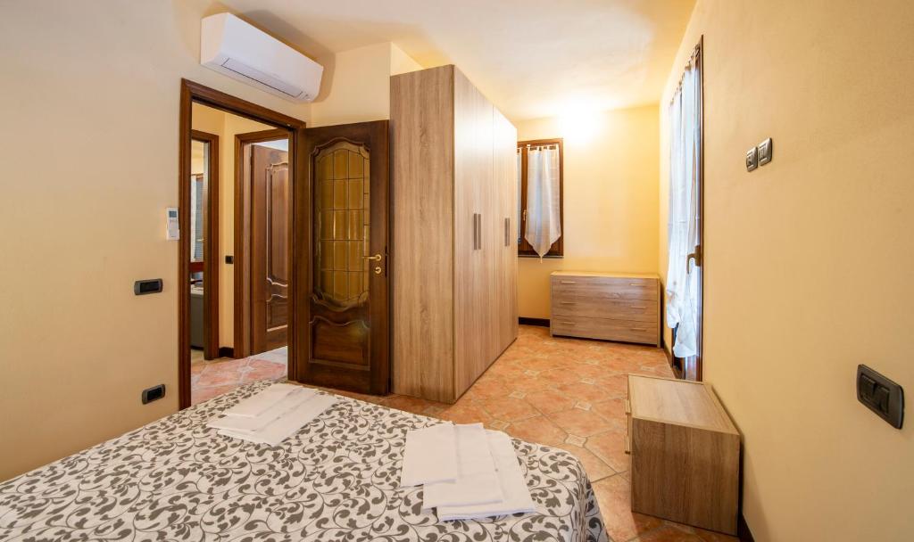 Posteľ alebo postele v izbe v ubytovaní Appartamenti Arco Antico