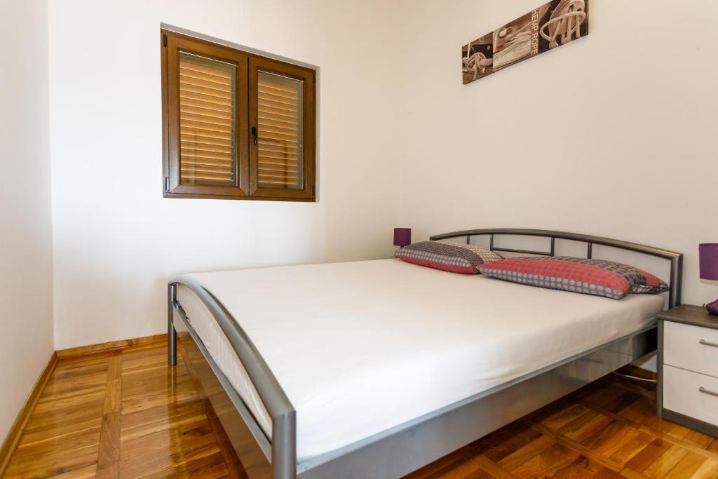 Postel nebo postele na pokoji v ubytování Apartment Iris & Elena