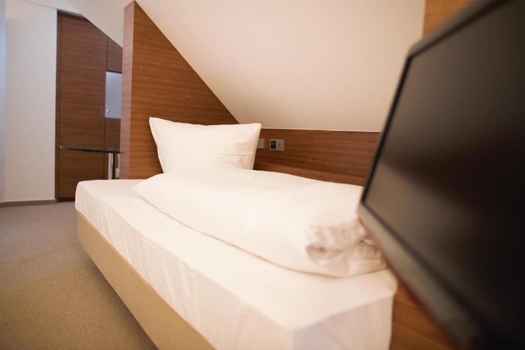 Postel nebo postele na pokoji v ubytování Meissmers Hotel