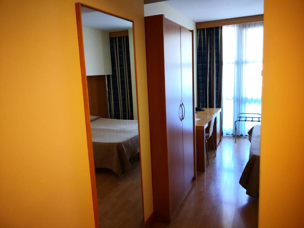 Postel nebo postele na pokoji v ubytování Hotel Ristorante Trendy