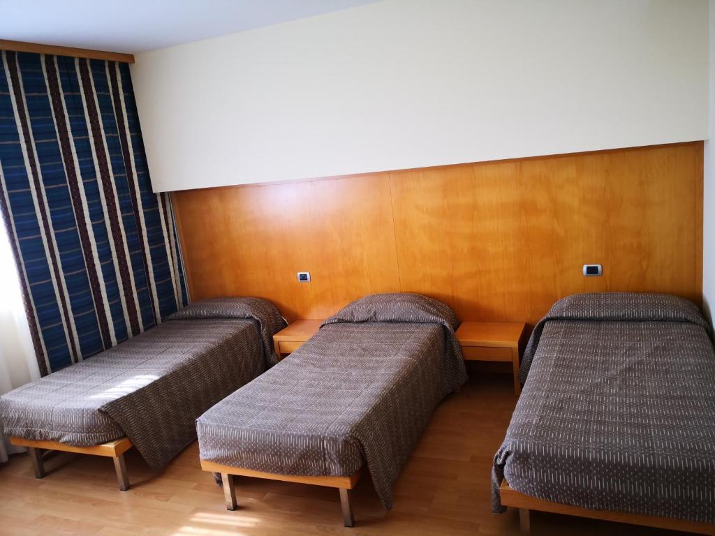 Postel nebo postele na pokoji v ubytování Hotel Ristorante Trendy