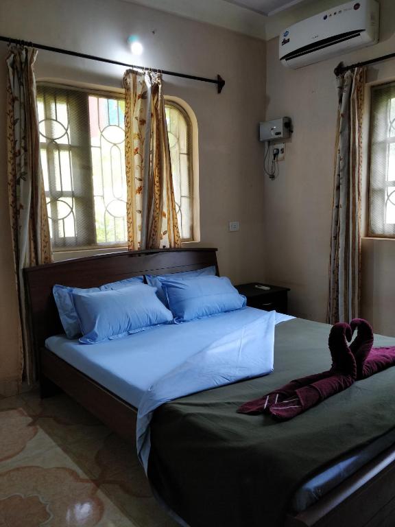 Postel nebo postele na pokoji v ubytování Koito-House calangute guest house