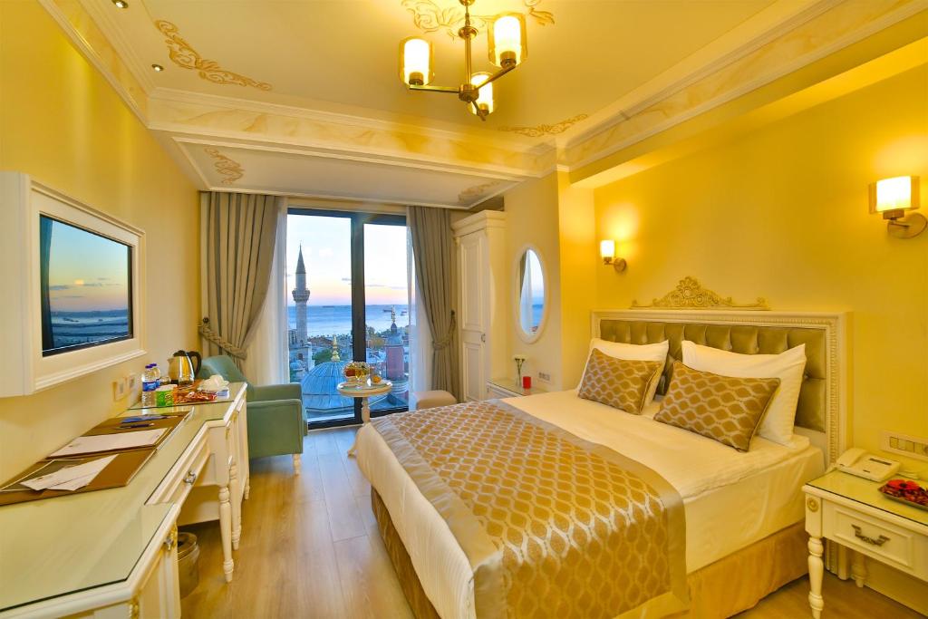A bed or beds in a room at Yılsam Sultanahmet Hotel